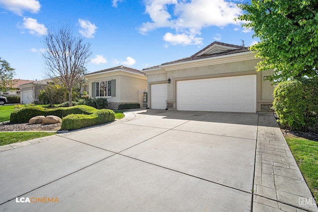 single story home with concrete driveway, a tile roof, stucco siding, stone siding, and an attached garage