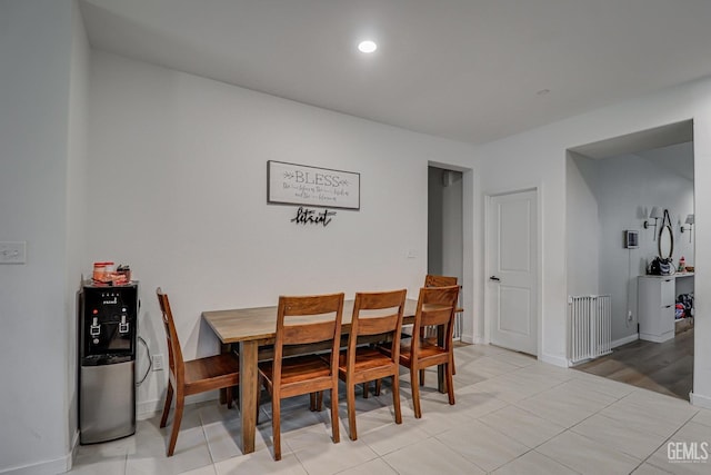 dining area with light tile patterned floors, recessed lighting, and baseboards