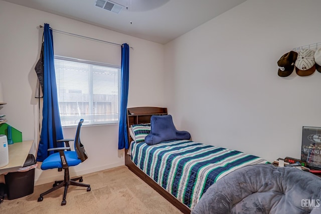 bedroom featuring visible vents, a ceiling fan, baseboards, and carpet floors