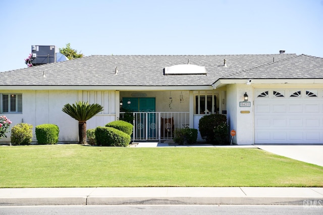 5421 Demaret Ave, Bakersfield, CA 93309 - ranch-style home with a garage, a front lawn, roof with shingles, and concrete driveway