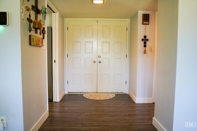 5421 Demaret Ave, Bakersfield, CA 93309 - corridor with dark wood finished floors and a textured ceiling
