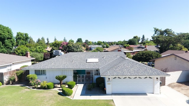 5421 Demaret Ave, Bakersfield, CA 93309 - ranch-style house featuring an attached garage, a shingled roof, and driveway