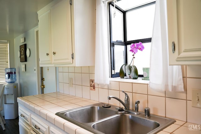 5421 Demaret Ave, Bakersfield, CA 93309 - kitchen featuring tile counters and tasteful backsplash