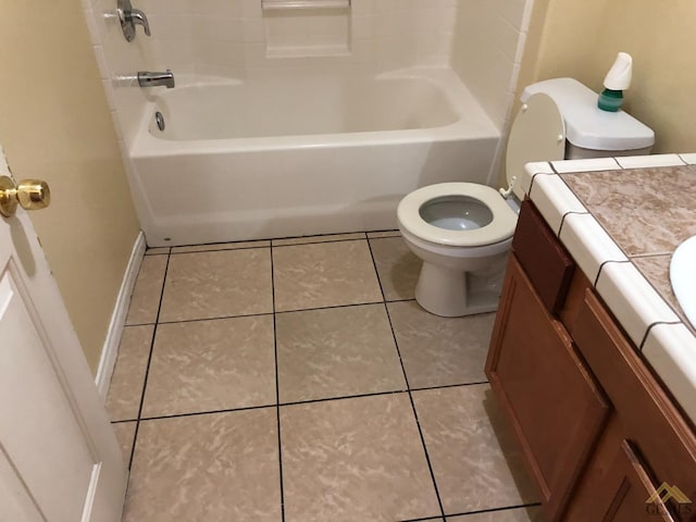 bathroom featuring tile patterned flooring, vanity, and toilet