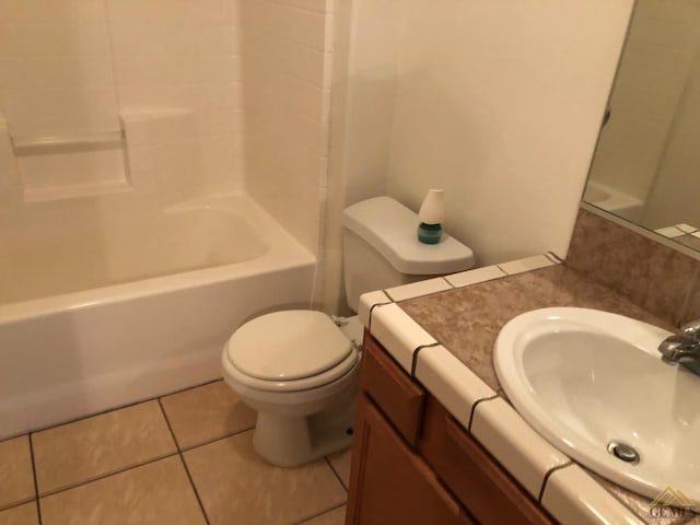 full bathroom featuring vanity, toilet,  shower combination, and tile patterned flooring