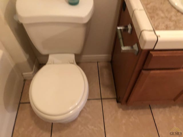 bathroom featuring tile patterned floors and toilet