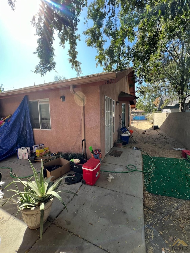 back of house with a patio