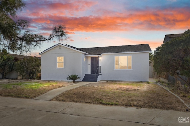 view of front of property with a lawn