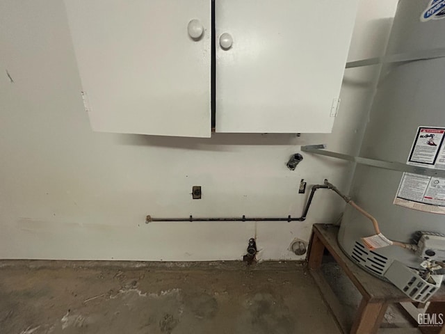 2626 Cleo Ct Unit 20, Bakersfield, CA 93306 - washroom with cabinet space and gas water heater