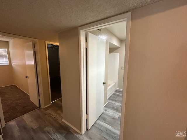2626 Cleo Ct Unit 20, Bakersfield, CA 93306 - hall with wood finished floors and a textured ceiling
