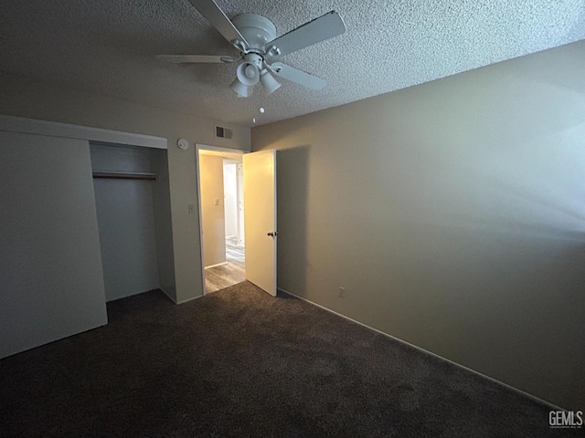 2626 Cleo Ct Unit 20, Bakersfield, CA 93306 - unfurnished bedroom featuring carpet flooring, a textured ceiling, a closet, and a ceiling fan