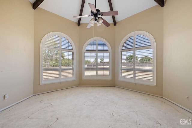 unfurnished room with beam ceiling, a ceiling fan, high vaulted ceiling, baseboards, and unfinished concrete floors