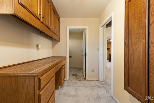 hall featuring concrete floors