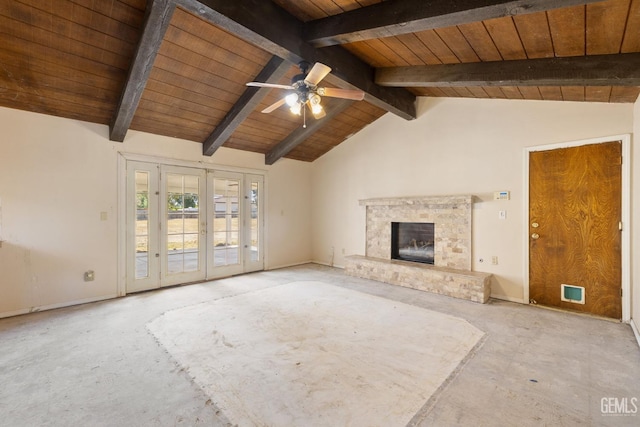 unfurnished living room featuring wood ceiling, a ceiling fan, and a fireplace with raised hearth
