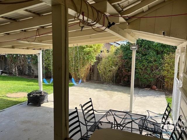 2320 Olympic Dr, Bakersfield, CA 93308 - view of patio with a fire pit