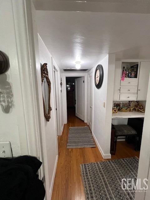 2320 Olympic Dr, Bakersfield, CA 93308 - corridor with light wood finished floors and baseboards