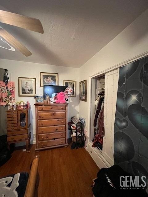 2320 Olympic Dr, Bakersfield, CA 93308 - bedroom with dark wood-style flooring and a ceiling fan