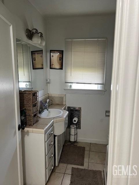 2320 Olympic Dr, Bakersfield, CA 93308 - bathroom with baseboards, tile patterned flooring, and vanity