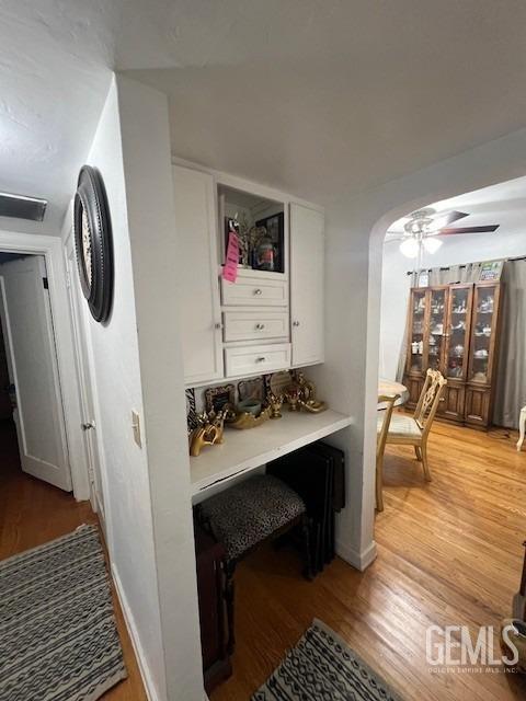 2320 Olympic Dr, Bakersfield, CA 93308 - mudroom featuring arched walkways, visible vents, a ceiling fan, and light wood finished floors