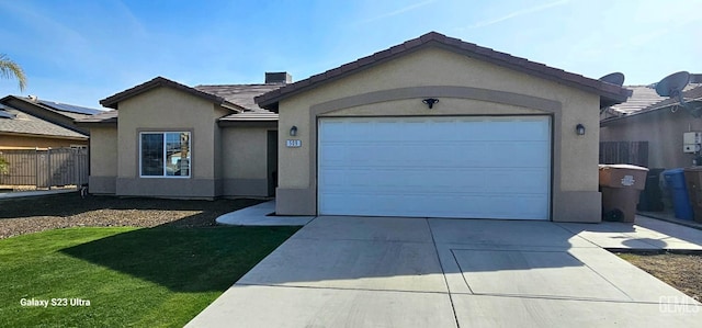 ranch-style home featuring an attached garage, fence, concrete driveway, a tiled roof, and stucco siding