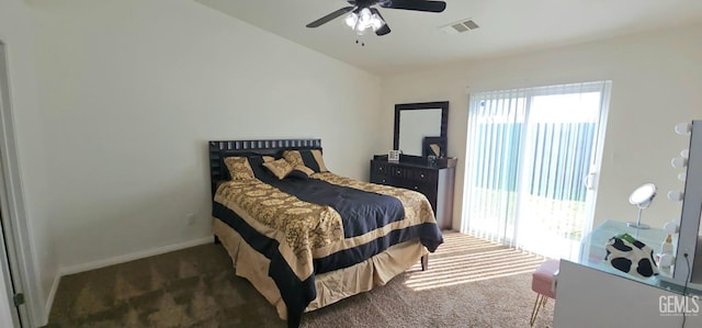 bedroom featuring visible vents, multiple windows, dark carpet, and baseboards