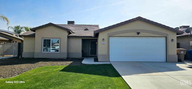 ranch-style house with a garage, a tile roof, driveway, stucco siding, and a front lawn