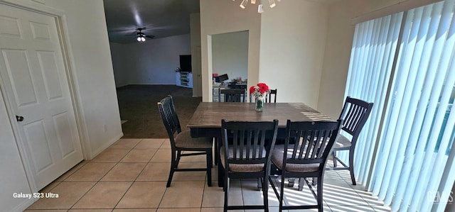 dining area featuring a ceiling fan, light tile patterned flooring, and plenty of natural light