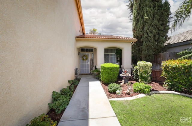 8315 Persimmon Dr, Bakersfield, CA 93311 - view of exterior entry with stucco siding and a tiled roof