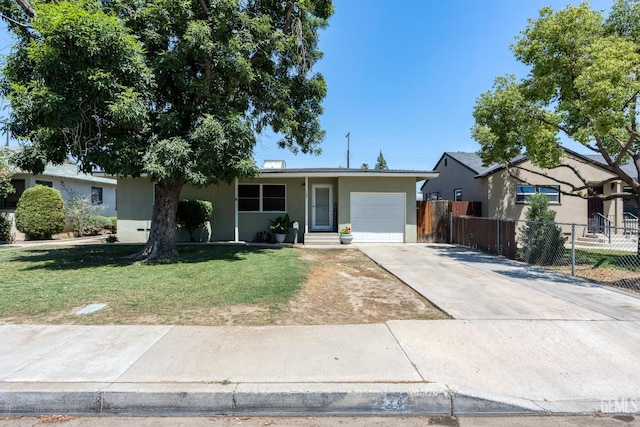 324 Western Dr, Bakersfield, CA 93309 - single story home featuring stucco siding, driveway, and a garage