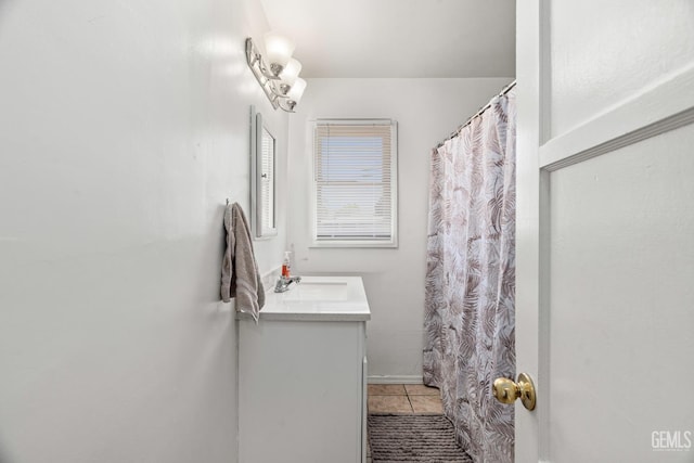 324 Western Dr, Bakersfield, CA 93309 - full bath featuring vanity, tile patterned floors, and curtained shower