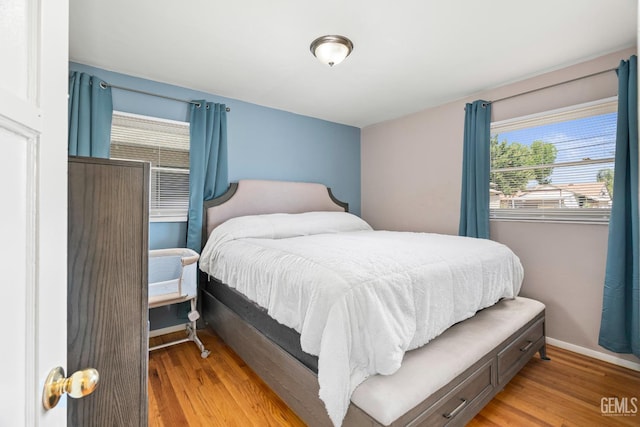 324 Western Dr, Bakersfield, CA 93309 - bedroom featuring multiple windows, light wood finished floors, and baseboards