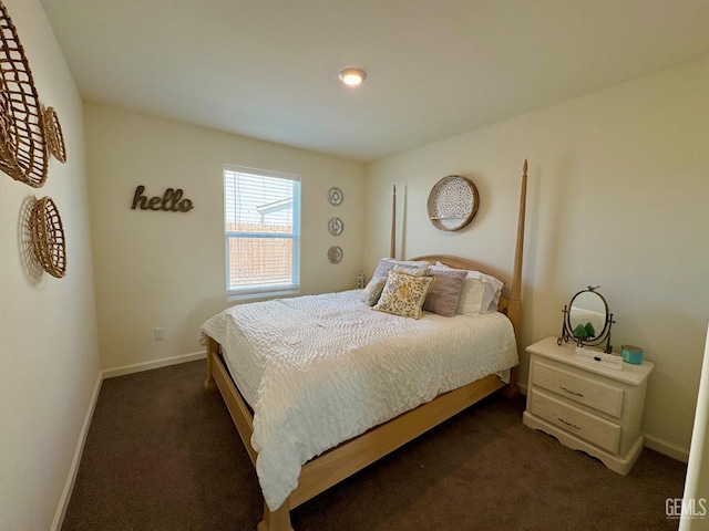 7303 Sepulveda Ct, Bakersfield, CA 93313 - bedroom featuring dark carpet and baseboards