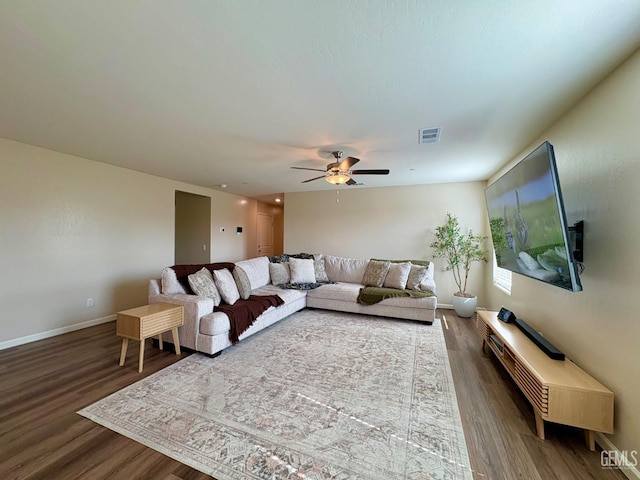 7303 Sepulveda Ct, Bakersfield, CA 93313 - living area featuring dark wood-style flooring and ceiling fan