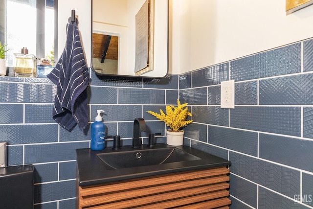 bathroom featuring vanity and decorative backsplash