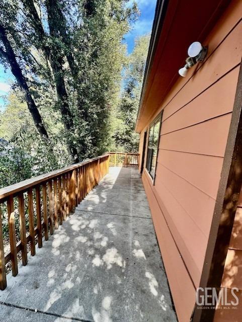 view of home's exterior with a wooden deck