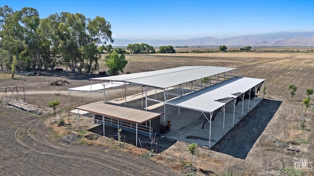 8661 Herring Rd, Bakersfield, CA 93313 - overview of rural landscape with a mountainous background