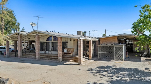 8661 Herring Rd, Bakersfield, CA 93313 - view of front of property with a porch