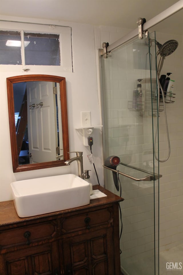 bathroom with vanity and an enclosed shower