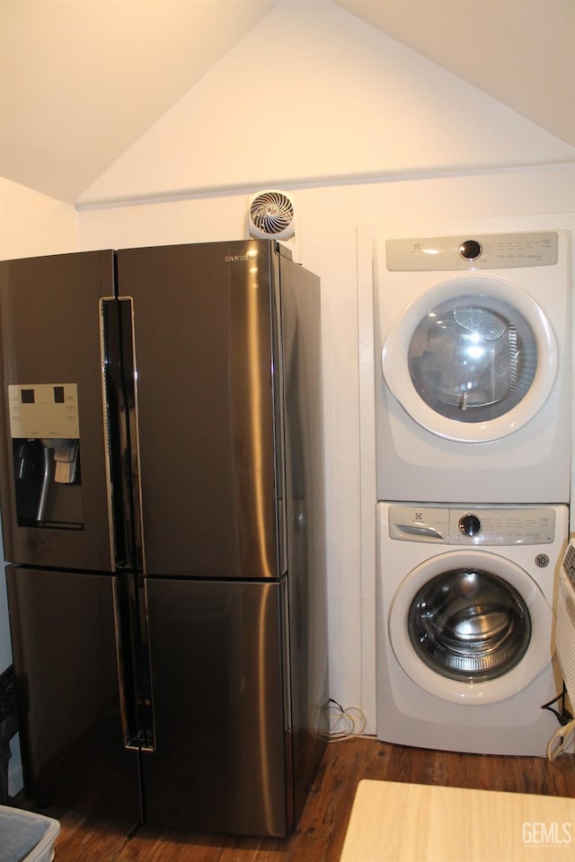 clothes washing area with dark hardwood / wood-style flooring and stacked washing maching and dryer