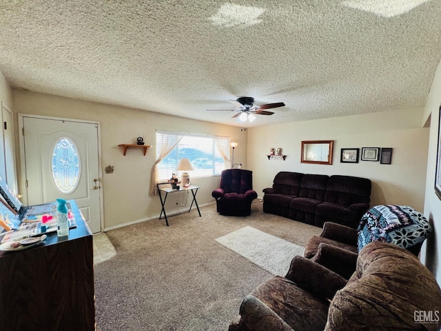 carpeted living room with a textured ceiling and ceiling fan