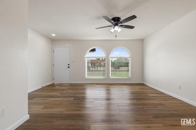 spare room featuring recessed lighting, wood finished floors, a ceiling fan, and baseboards