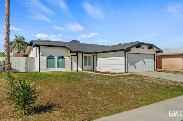 single story home with a garage, a front lawn, concrete driveway, and fence