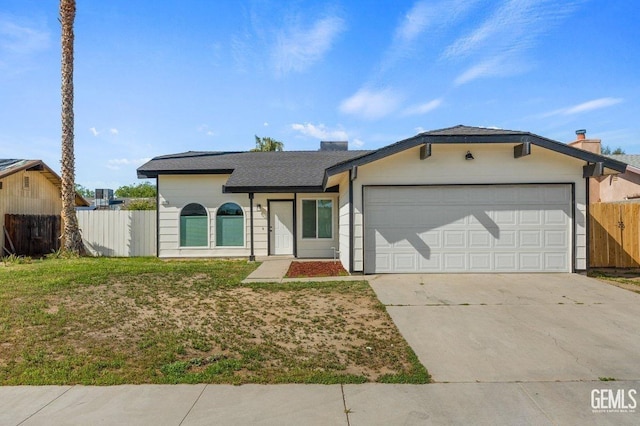 ranch-style house with driveway, a chimney, fence, an attached garage, and a front yard