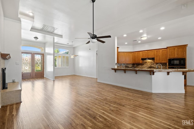 4207 Crystal Lake Dr, Bakersfield, CA 93313 - unfurnished living room with wood finished floors, recessed lighting, and a ceiling fan