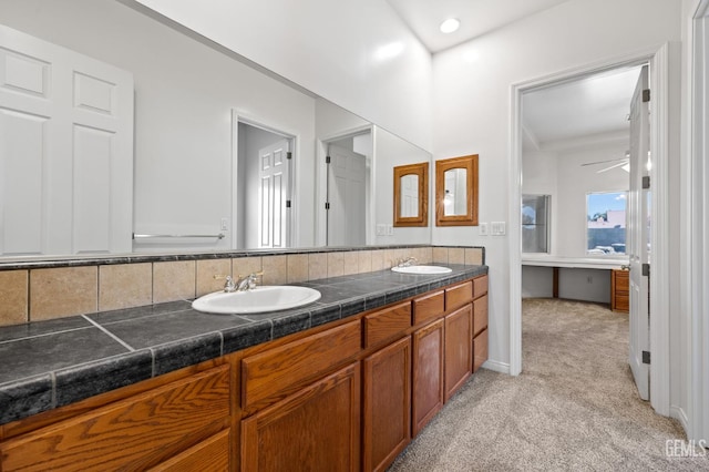 4207 Crystal Lake Dr, Bakersfield, CA 93313 - full bath with double vanity, a ceiling fan, and carpet flooring