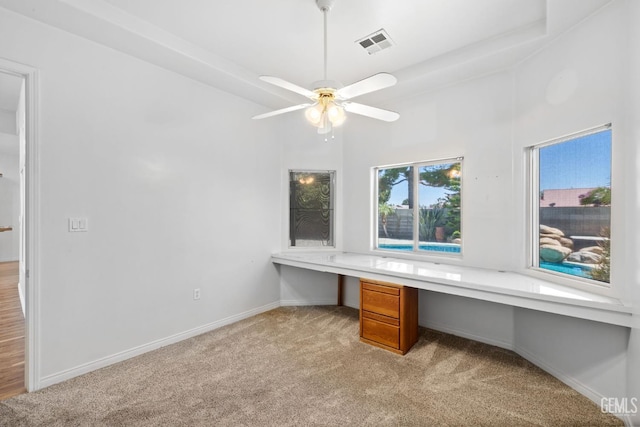 4207 Crystal Lake Dr, Bakersfield, CA 93313 - unfurnished office featuring built in study area, light colored carpet, ceiling fan, and a towering ceiling