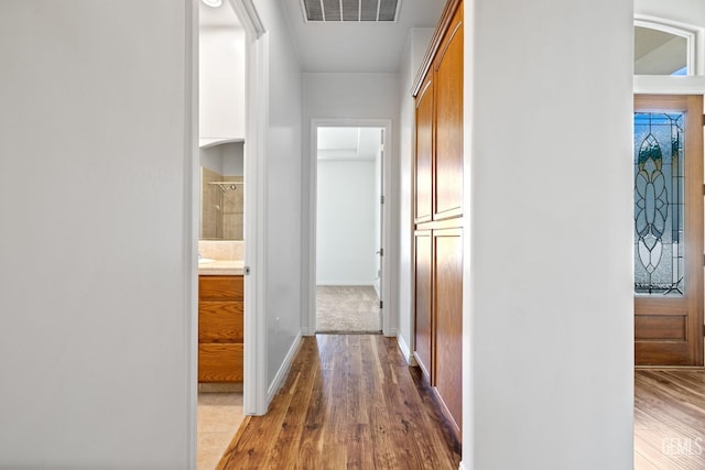 4207 Crystal Lake Dr, Bakersfield, CA 93313 - hallway featuring wood finished floors and baseboards