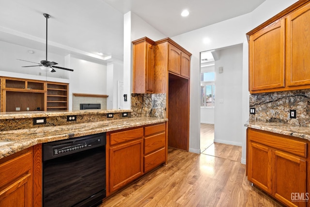 4207 Crystal Lake Dr, Bakersfield, CA 93313 - kitchen featuring black dishwasher, decorative backsplash, light stone counters, light wood-style flooring, and recessed lighting
