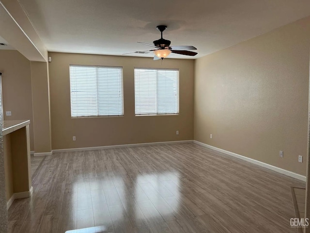 5413 Ridgecrest Ct, Bakersfield, CA 93313 - unfurnished living room with ceiling fan and wood finished floors