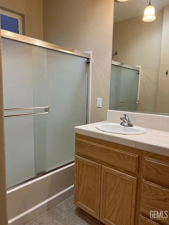 5413 Ridgecrest Ct, Bakersfield, CA 93313 - full bath with vanity, combined bath / shower with glass door, and tile patterned flooring